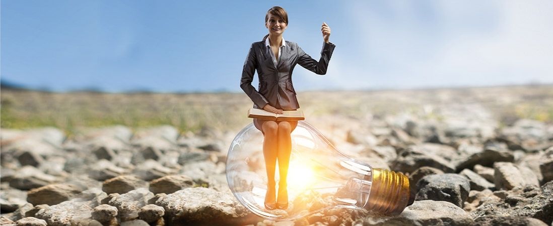 female leader sitting in the bulb light