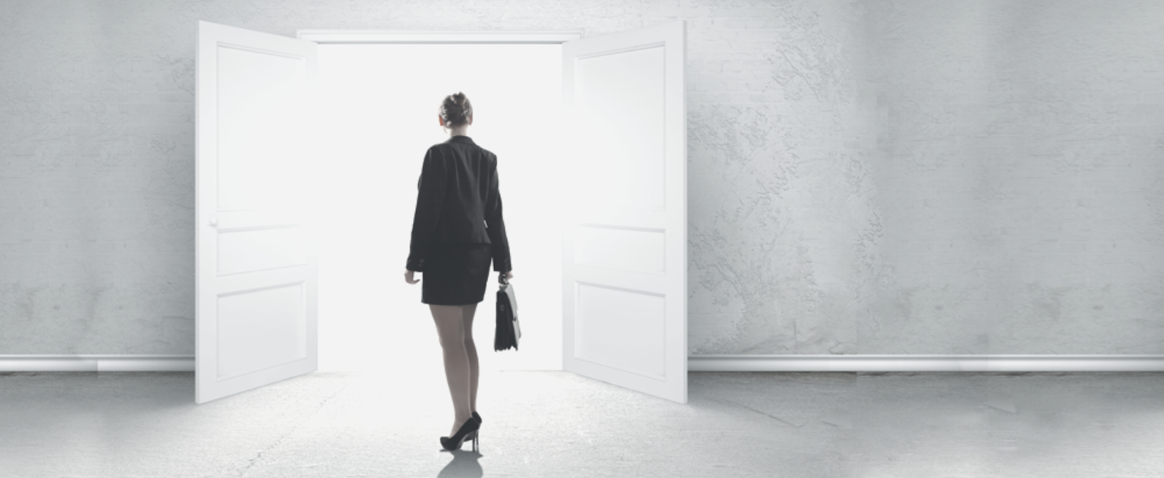 Woman in Business standing on the open door-Suzie_Lightfoot