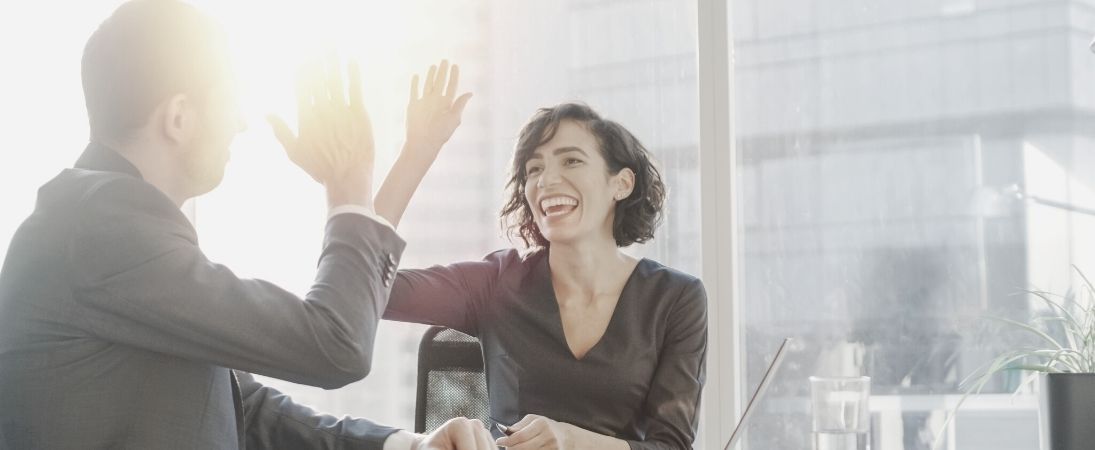 man and female leader build a profitable brand partnership and referrals